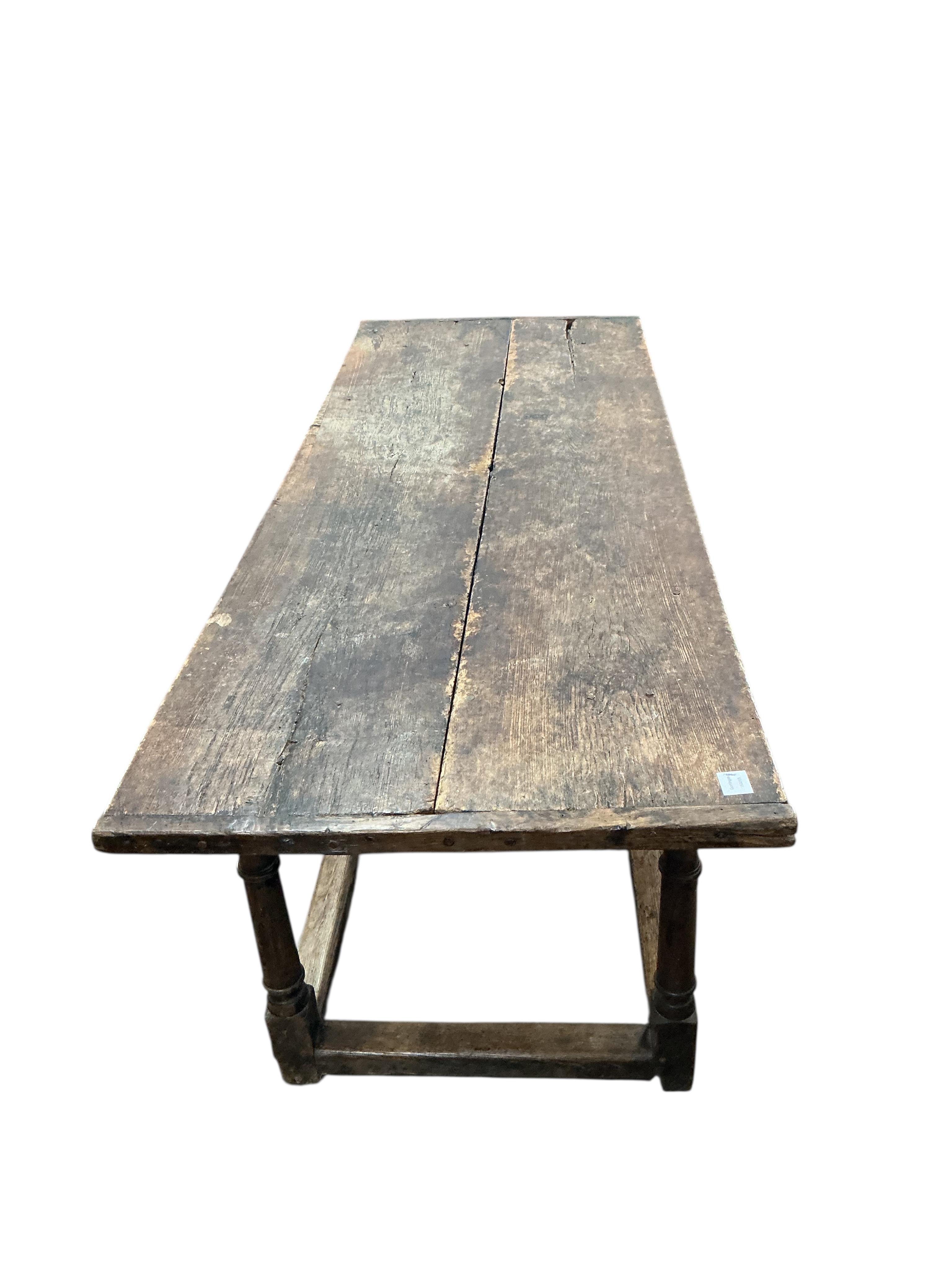 A 17th century and later rectangular oak refectory dining table, width 212cm, depth 75cm, height 77cm